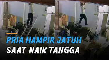 Hampir saja jatuh dari tangga. Pria ini masih bisa bergelantungan di bagian atas gedung.