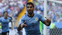 Uruguay dipastikan lolos ke babak 16 besar Piala Dunia 2018 setelah mengalakan Arab Saudi dengan skor 1-0 berkat gol Luis Suarez. (AFP/Khaled Desouki)
