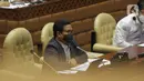 Menteri Desa, Pembangunan Daerah Tertinggal, dan Transmigrasi (Mendes PDTT) Abdul Halim Iskandar mengikuti rapat kerja dengan Komisi V DPR di Senayan, Jakarta, Senin (11/4/2022). Rapat membahas isu-isu terkait desa tertinggal serta rekruitmen Tenaga Pendamping Desa. (Liputan6.com/Angga Yuniar)