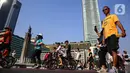 Warga beraktivitas di kawasan Bundaran Hotel Indonesia, Jakarta, Minggu (27/10/2024). (Liputan6.com/Angga Yuniar)