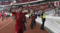 Bek Timnas Indonesia, Amiruddin Bagas Arrizqi merayakan hasil imbang melawan Korea Utara pada laga kualifikasi Grup K Piala AFC U-19 2020 di Stadion Utama Gelora Bung Karno, Jakarta, Minggu (10/11/2019). Indonesia lolos ke putaran Piala AFC U-19 2020. (Liputan6.com/Helmi Fithriansyah)