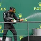 Pembalap Mercedes Lewis Hamilton merayakan kemenangan pada ajang F1 GP Belgia 2020 di Spa-Francorchamps, Minggu (30/8/2020). (Francois Lenoir/Pool Photo via AP)