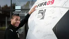 Standard's player Oguchi Onyewu signed a giant soccer ball, Wednesday 29 October 2008, in front of the Academie Robert Louis Dreyfus, in Angleur. BELGIA PHOTO HAND OUT