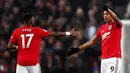 Pemain Manchester United Anthony Martial (kanan) merayakan golnya ke gawang Newcastle United pada pertandingan Liga Inggris di Old Trafford, Manchester, Inggris, Kamis (26/12/2019). Manchester United menang 4-1 atas Newcastle United. (Martin Rickett/PA via AP)