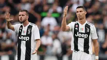 Miralem Pjanic (kiri) meyakini dampak positif yang diberikan Cristiano Ronaldo untuk Juventus. (Marco BERTORELLO / AFP)