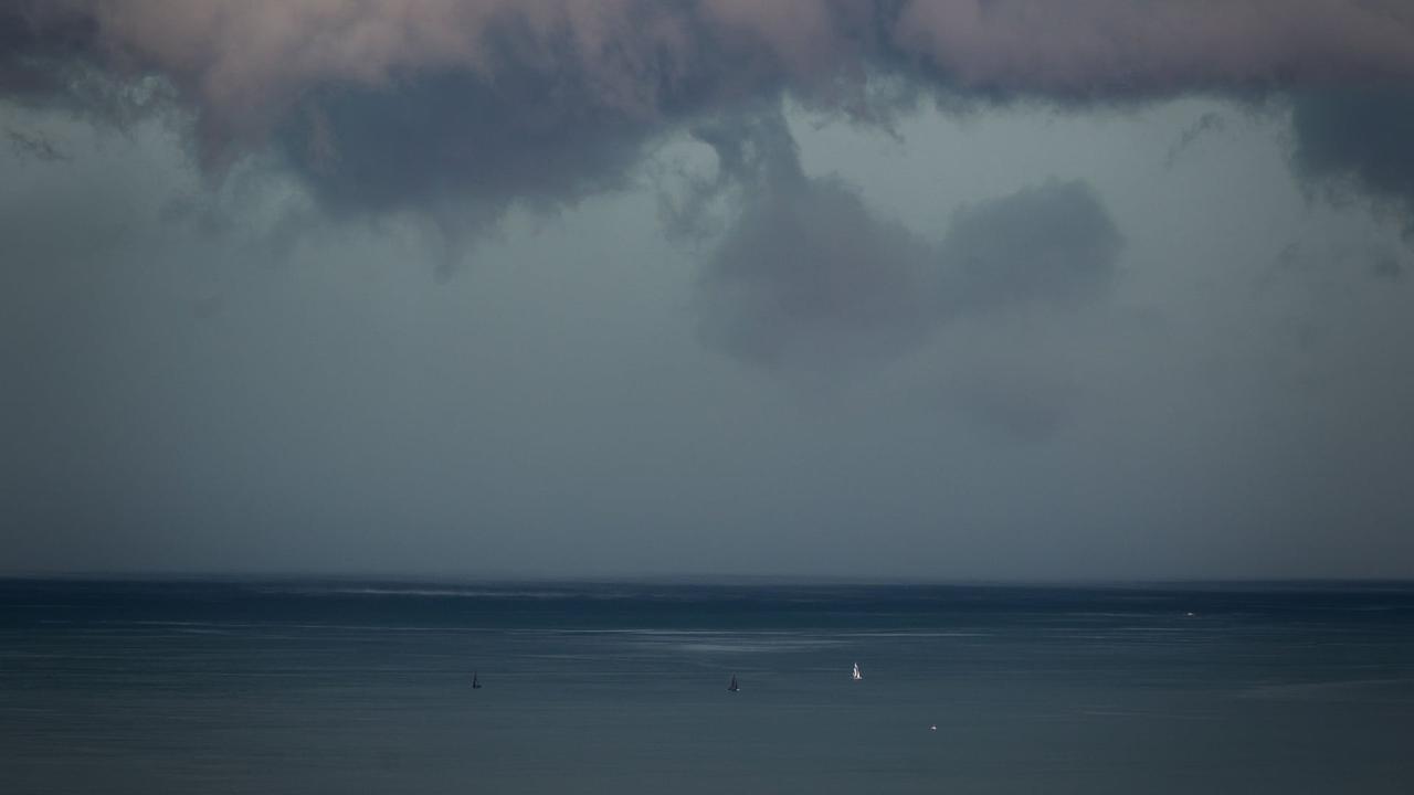 Ilustrasi cuaca buruk (AFP/Fabrice Coffrini)