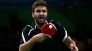 Ekspresi Atlet Tenis Meja asal Mesir, Khalid Assar berusaha memukul bola saat melawan Jianan Wang dari Kongo pada cabang tenis meja tunggal putra Olimpiade Rio 2016 di Rio de Janeiro, Brasil, (7/8). (REUTERS/Alkis Konstantinidis)