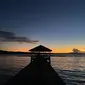 Sunset di kawasan pariwisata pantai Paradise Desa Maen - Likupang, Sumatera Utara, 10 Agustus 2022. (Liputan6.com/Yulia Lisnawati)