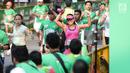 Ekpresi peserta Lomba lari MILO Jakarta International 10K 2017 saat sampai di garis finis, Jakarta, Minggu (23/7). MILO Jakarta International 10K 2017 melombakan tiga kategori yakni 10K, 5K dan Family Run 1,7K. (Liputan6.com/Faizal Fanani)