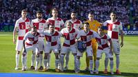 Para pemain starting XI Timnas Kroasia berfoto bersama jelang dimulainya laga Grup B Euro 2024 menghadapi Timnas Spanyol di Olympiastadion, Berlin, Jeman, Sabtu (15/6/2024). (AP Photo/Sergei Grits)