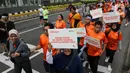 Salah satu peserta fun walk bertema 'Jalan Sehat, Berantas Hoaks' mengapresiasi kegiatan ini, terlebih dalam menyuarakan perlawanan terhadap hoaks lewat jalan santai di CFD. (Liputan6.com/Herman Zakharia)