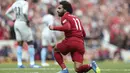Penyerang Liverpool, Mohamed Salah, melakukan selebrasi usai mencetak gol ke gawang West Ham pada laga Premier League di Stadion Anfield, Minggu (12/8/2018). Liverpool menang 4-0 atas West Ham. (AP/David Davies)