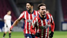 Pemain Atletico Madrid, Saul Niguez, melakukan selebrasi usai mencetak gol ke gawang Sevilla pada laga Liga Spanyol di Stadion Wanda Metropolitano, Selasa (12/1/2021). Atletico Madrid menang dengan skor 2-0. (AFP/Pierre-Philippe Marcou)