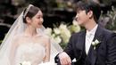 <p>Kim Yuna dan Ko Woo Rim di hari pernikahan mereka. Keduanya tampak serasi bersanding bersama. (Foto: Instagram/ yunakim)</p>