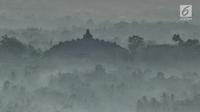 Pemandangan Candi Borobudur saat pagi hari dari Punthuk Setumbu, Magelang, Jawa Tengah, Jumat (19/10). Dari Punthuk Setumbu tempat ini wisatawan bisa melihat kemegahan Candi Borobudur. (Liputan6.com/Herman Zakharia)