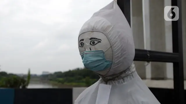FOTO: Patung Bermasker Upaya Kampanye COVID-19