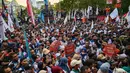 Aksi tersebut menggemakan beragam tuntutan untuk perubahan sosial kehidupan, terutama para pekerja. (Juni KRISWANTO/AFP)