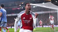 Selebrasi Gabriel Magalhaes dalam laga Premier League antara Arsenal vs Tottenham, Kamis (16/1/2025). (c) PA via AP Photo/Bradley Collyer