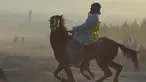 Penunggang kuda Afghanistan bersaing memperebutkan bangkai hewan dalam pertandingan Buzkashi di Herat, Afghanistan (4/2/2022). Buzkashi merupakan tradisi yang dilakukan oleh warga Afghanistan yang setiap pesertanya harus menunggang kuda. (AFP/Wakil Kohsar)