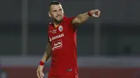 Penyerang Persija Jakarta, Marko Simic melakukan selebrasi usai mencetak gol kedua timnya ke gawang PSIS Semarang dalam laga pekan kedua BRI Liga 1 2021/2022 di Indomilk Arena, Tangerang, Minggu (12/9/2021). Kedua tim bermain imbang 2-2. (Foto: Bola.Com/M