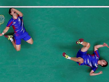  Ekspresi pemain Korea Selatan, Kim Ki-Jung dan Kim Sa-Rang, setelah mengalahkan pasangan Denmark dalam penyisihan grup bulutangkis Olimpiade Rio 2016 di Riocentro Pavilion 4, Rio de Janeiro, Brasil, (13/8/2016). (Reuters/Marcelo Del Pozo)