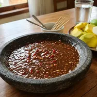 Resep Bumbu Rujak Gula Merah Tanpa Kacang. (AI Generated)