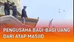 Aksi bagi-bagi uang oleh pengusaha kembali terjadi. Beberapa pria pengusaha pecel lele membagikan uang dari atap masjid. Disebut terjadi di Desa Bugoharjo, Lamongan, Jawa Timur (9/5/2022).