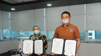 Penandatangan kerja sama KKP dengan kalikan.id untuk memperkuat jangkauan pasar ikan hias air tawar Indonesia.(Foto: Liputan6.com/KKP)