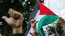 Massa Gerakan Pekerja Muslim Indonesia (GPMI) melakukan aksi solidaritas untuk Palestina di kawasan Thamrin Jakarta, Jumat (28/5/2021). Mereka menyuarakan keprihatinan atas tragedi kemanusiaan di Palestina, serta mewujudkan perdamaian dunia dan kemerdekaan atas Palestina (Liputan6.com/Faizal Fanani)
