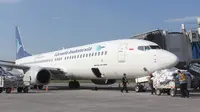 Ilustrasi maskapai penerbangan Garuda Indonesia saat berhenti di apron Bandara Adi Soemarmo.(Liputan6.com/Fajar Abrori)