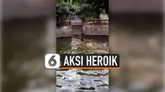 Seorang pria mengerjai anjing kesayangannya dengan cara berpura-pura tenggelam sambil memanggil nama anjing itu. Mendengar sang majikan meminta bantuan, anjing bergegas menyelamatkan. Begini aksinya heroiknya.
