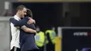 Pelatih Juventus, Andrea Pirlo memeluk bek Leonardo Bonucci usai pertandingan melawan AC Milan di stadion San Siro, Rabu (7/1/2021). Pirlo menuturkan kunci timnya bisa mengalahkan Milan. Dia menempatkan Federico Chiesa untuk satu lawan satu menghadapi Theo Hernandez. (AP Photo/Antonio Calanni)