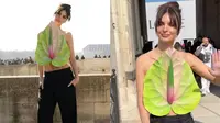 Emily Ratajkowski jadi pusat perhatian saat menghadiri gelaran Paris Fashion Week Fall/Winter 2023. (Dok: Instagram @voguemagazine dan @loewe)