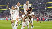 Pemain Maroko&nbsp;merayakan gol pertama timnya yang dicetak oleh&nbsp;Hakim Ziyech saat matchday ketiga Grup F Piala Dunia 2022 melawan Kanada di&nbsp;Al Thumama Stadium, Doha Kamis (01/12/2022). (AP/Pavel Golovkin)
