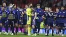 Kapten Skotlandia Andrew Robertson (tengah) dihibur oleh kiper David Marshall pada akhir laga melawan Kroasia pada pertandingan Grup D Euro 2020 di Stadion Hampden Park, Glasgow, Selasa (22/6/2021). Kroasia menang 3-1. (Lee Smith, Pool Photo via AP)