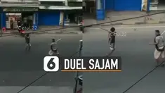 Beredar video dua lelaki saling adu senjata tajam di tengah jalan.