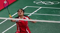 Tunggal putri Indonesia, Gregoria Mariska Tunjung, menang mudah atas wakil Myanmar, Thet Htar Thuzar, dengan skor 21-11, 21-8 pada laga pembuka Olimpiade 2020. (AFP/Pedro