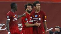 Kolaborasi keduanya plus Roberto Firmino di lini depan Liverpool membuat The Reds meraih kejayaannya baik di level domestik maupun di pentas Eropa. (AFP/Pool/Phil Noble)