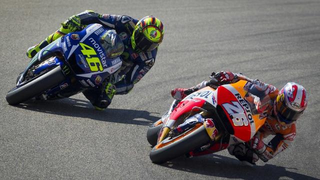 Valentino Rossi dan Dani Pedrosa terlibat pertarungan sengit di MotoGP Aragon, Spanyol, Minggu (27/9/2015) namun Jorge Jorenzo yang sukses meraih juara di sini.