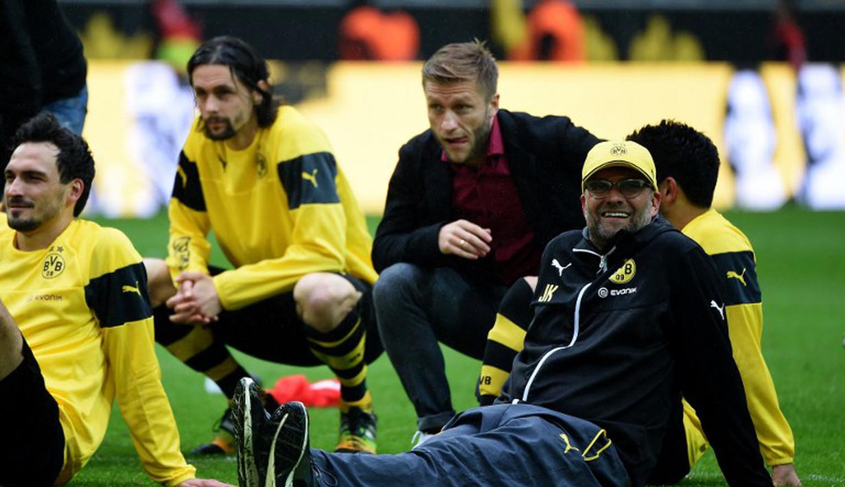 Selama tujuh musim membesut Dortmund, Juergen Klopp berhasil mempersembahkan lima gelar juara. (PATRIK STOLLARZ/AFP)