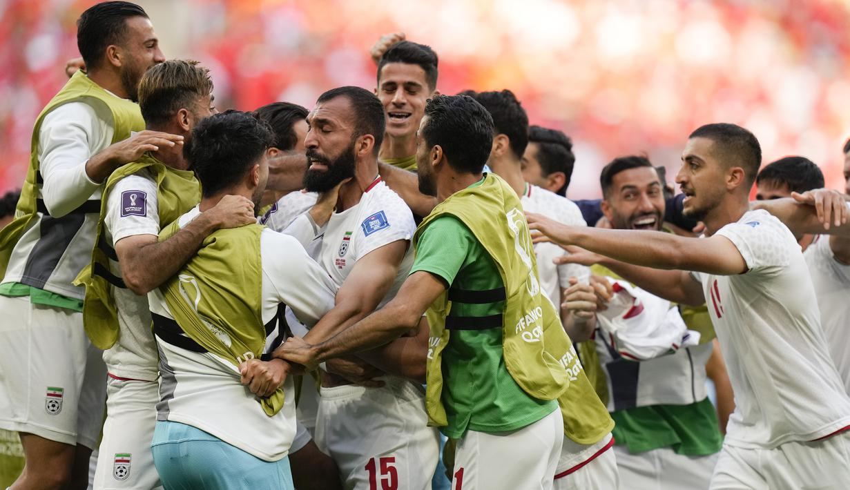 Kemenangan susah payah diraih timnas Iran usai mengalahkan timnas Wales dengan skor 2-0 yang dicetak pada waktu injury time. (AP Photo/Francisco Seco)