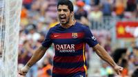 Luis Suarez melakukan selebrasi usai bobol gawang Las Palmas (Reuters)