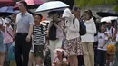 <p>Suhu tertinggi bulan Juni sebelumnya dicatat pada 10 Juni 1961, ketika suhu mencapai 40,6 derajat celsius. (AP Photo/Andy Wong)</p>