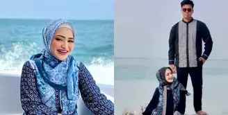 Jadi model koleksi pakaian terbaru Ivan Gunawan, Nathalie dan Frans jalani pemotretan di pantai.