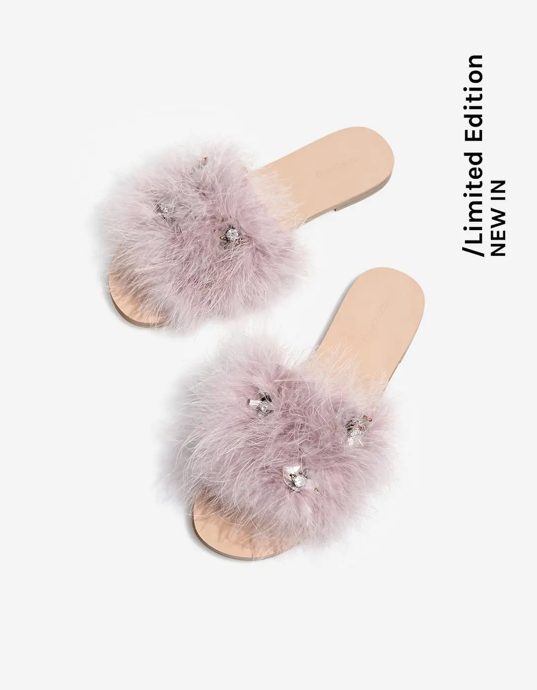 Bejewelled slides with feather strap. (stradivarius.com)