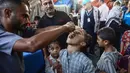 Sebelumnya, pada 16 Agustus 2024, Kementerian Kesehatan Palestina melaporkan kasus pertama polio di Jalur Gaza. (Eyad BABA/AFP)
