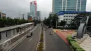 Suasana jalan HR Rasuna Said Jakarta, Kamis (5/5/2016). Sejumlah ruas jalan utama di Jakarta terpantau lengang terkait libur panjang dua hari besar keagamaan dan akhir pekan. (Liputan6.com/Helmi Fithriansyah)