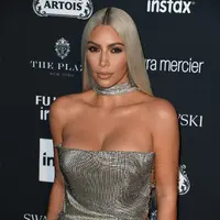 Pasangan suami istri yang belum lama ini dikabarkan akan bercerai, belakangan membawa kabar bahagia mengenai karunia yang mereka dapatkan berupa hadirnya anak ke-3 mereka. (AFP/Angela Weis)