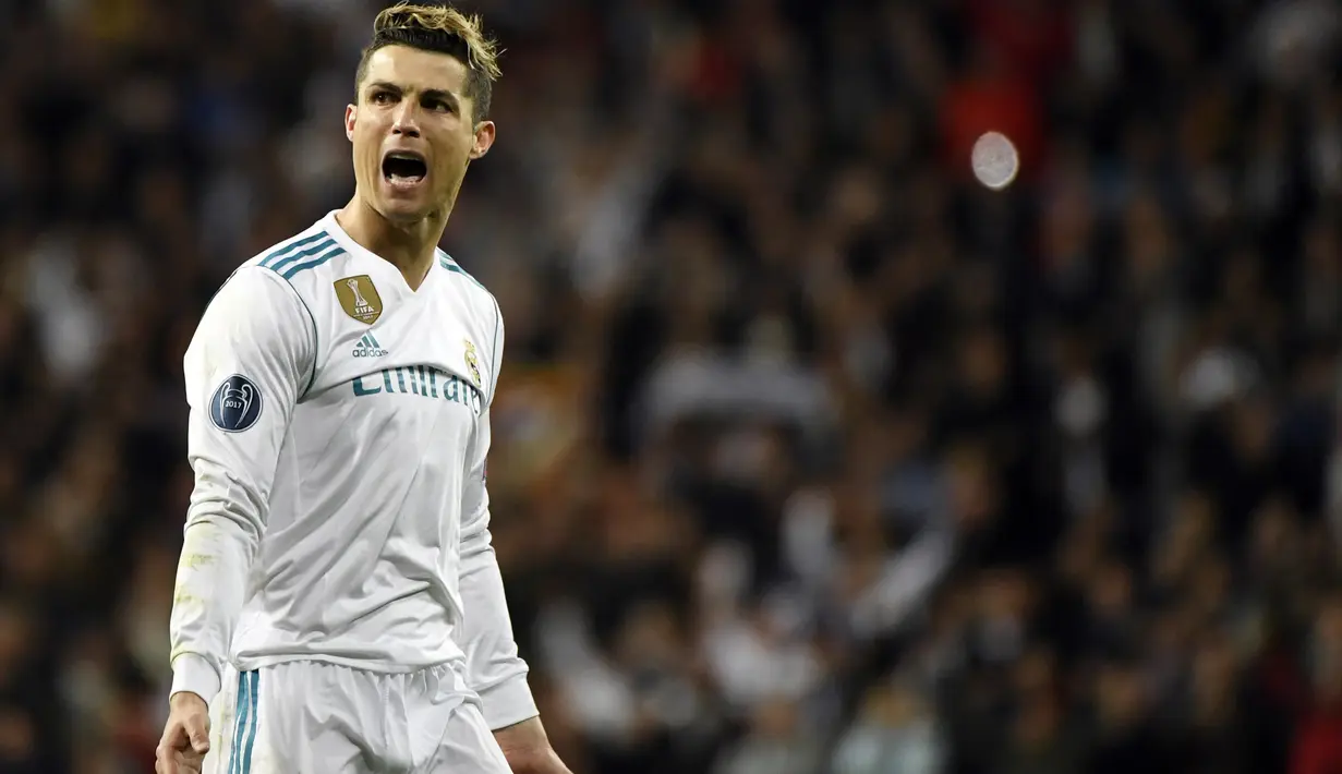 Bintang Real Madrid, Cristiano Ronaldo merayakan golnya ke gawang Juventus pada leg kedua perempat final Liga Champions di Santiago Bernabeu stadium, Madrid, (11/4/2018). Real Madrid menang agregat 4-3. (AFP/Peirre-Philippe Marcou)