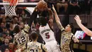 Pemain San Antonio Spurs, LaMarcus Aldridge (12) melakukan blok tembakan pemain Miami Heat  Amar'e Stoudemire (5) pada lanjutan NBA di AT&T Center, Texas, Kamis (24/3/2016). San Antonio Spurs menang 112-88. (Mandatory Credit: Soobum Im-USA TODAY Sports)